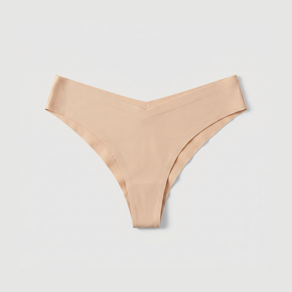 LivMist™ Seamless Low-Rise Thong — Beige flat lay (front)